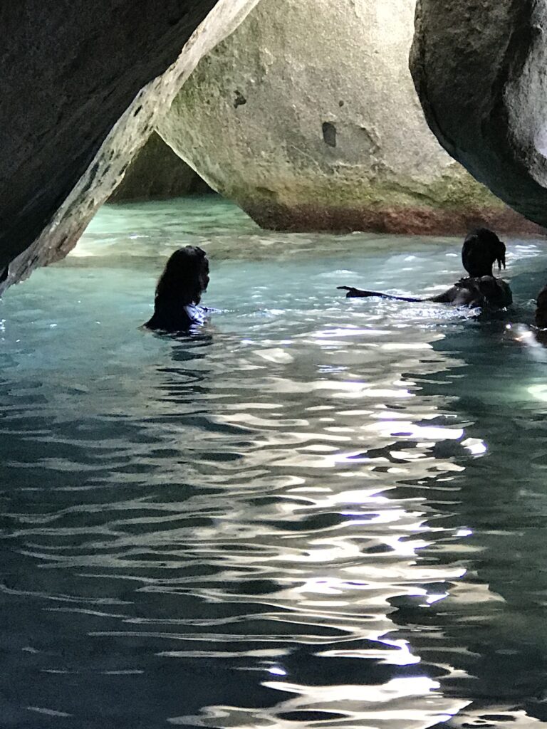 Two women enjoying the largest of the natural pools at the Baths of Virgin Gorda.